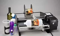 Label applicator for bottles